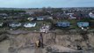 Demolition teams tear down clifftop homes suffering from coastal erosion in Norfolk village