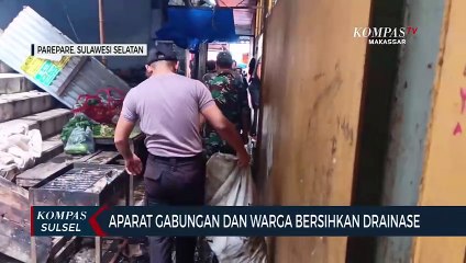 Aparat  Gabungan Dan Warga Bersihkan Drainase