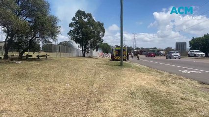 WATCH: Garbage truck dumps alight load on Industrial Drive