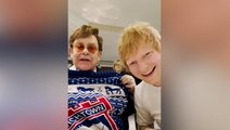 Ed Sheeran and Elton John swap Christmas presents and pull crackers as they watch Ipswich Town match