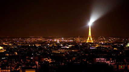 Eiffel tower illuminated at night.