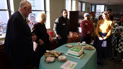 Queen in festive spirit at anniversary of charity
