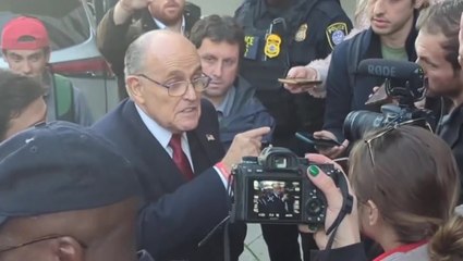 Angry Rudy Giuliani leaves court after being ordered to pay $148 million to election workers he defamed