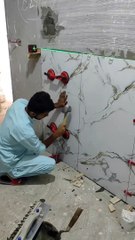 Beautiful Big Tiles pasting on the wall.