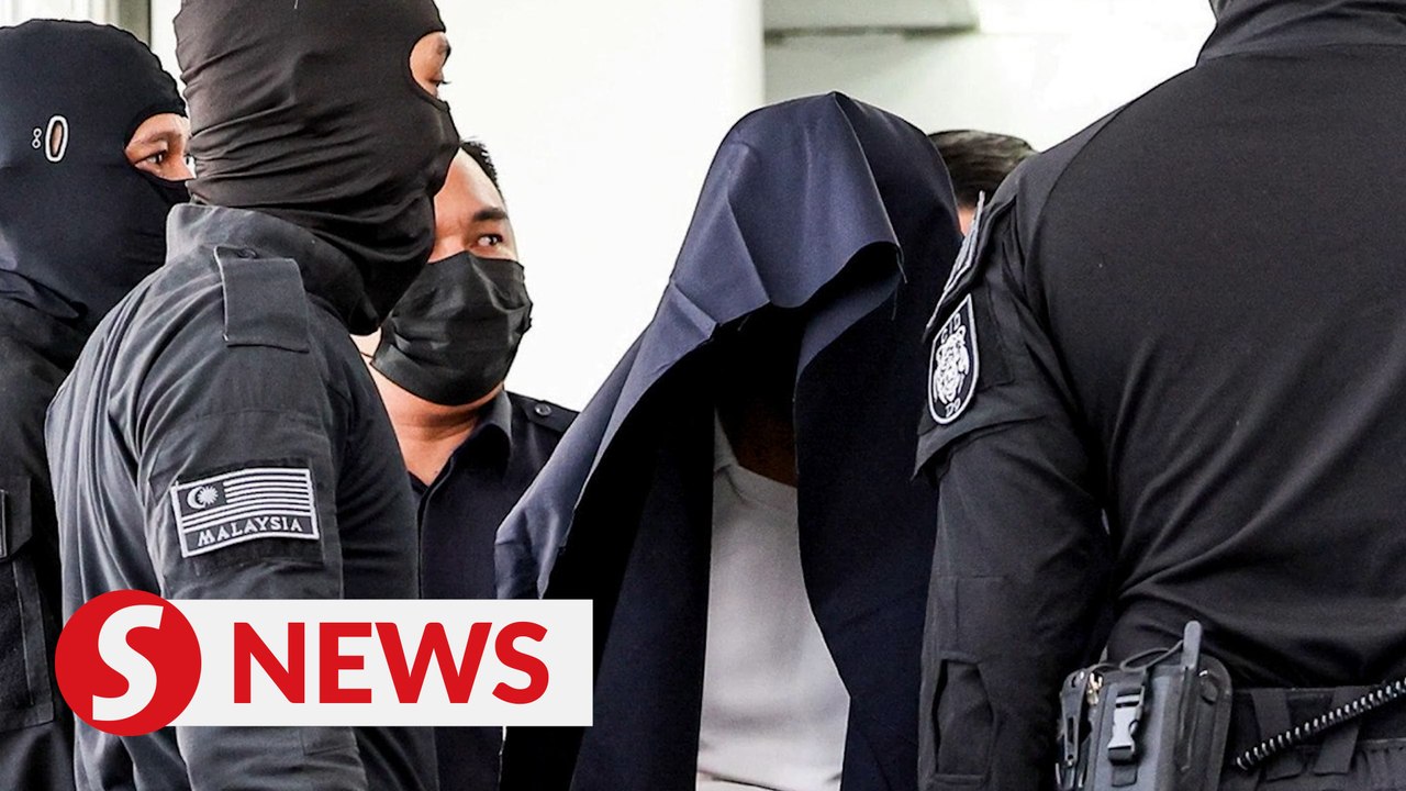 Senior cops on murder charge gives media the slip on the way into courtroom