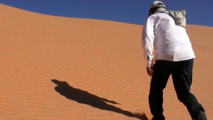 Teenagers run around the sand on Sahara Desert.