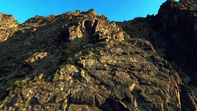 A Cinematic Drone Flight over a Beautiful Golden Mountain Sunset 4k