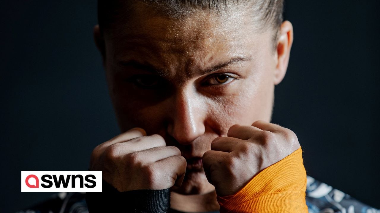 Female bare-knuckle fighter trains by punching concrete paving slabs