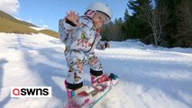 Trio von furchtlosen Geschwistern fährt mit dem Snowboard die österreichischen Alpen hinunter