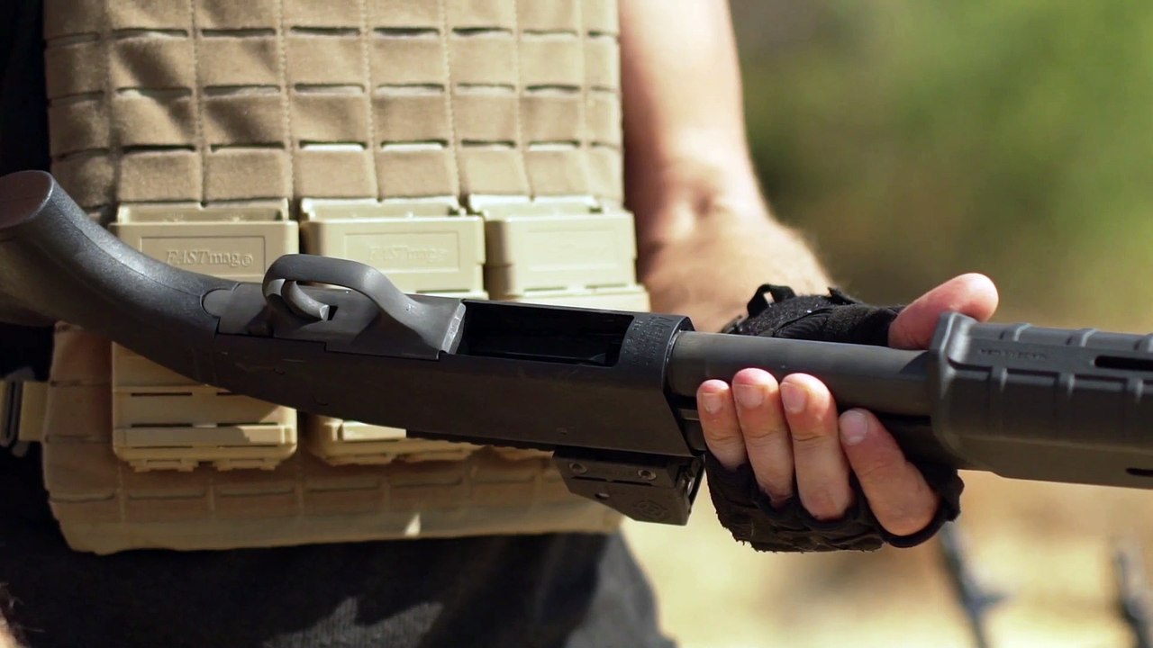 Man Charging Rounds In Airsoft Shotgun Outdoors