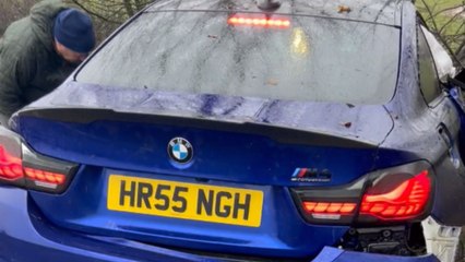 Horrible aftermath of a BMW crashing into a tree during rain