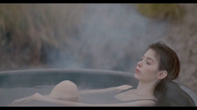 A woman swimming in a pond in the middle of the snow with musique sentimental - أجمل موسيقى عاطفية حزينة من الزمن الجميل