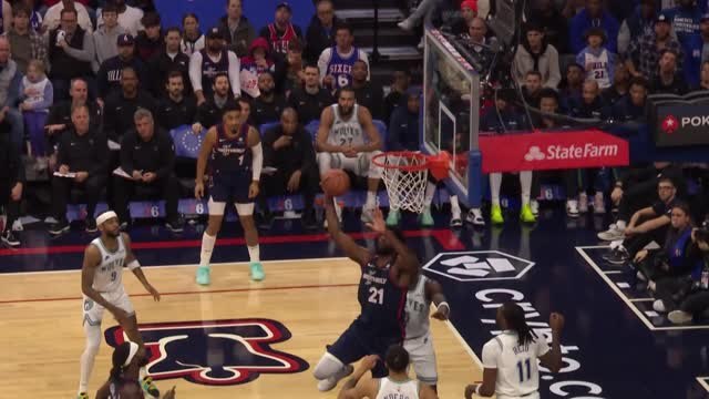 Embiid spins past Reid for the reverse dunk