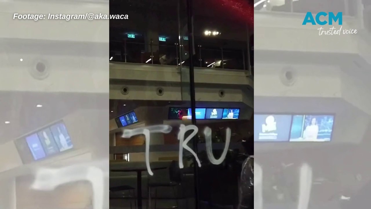 Activists spray red paint on the ABC Melbourne office
