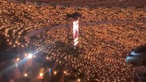 Nearly 200K worshippers hold candles up at once during majestic Christmas celebration in Indonesia