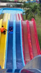 Guy Helps Boy Stuck in the Middle of Water Slide
