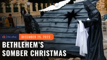 Somber Bethlehem marks Christmas with vigil as bombs rain on Gaza