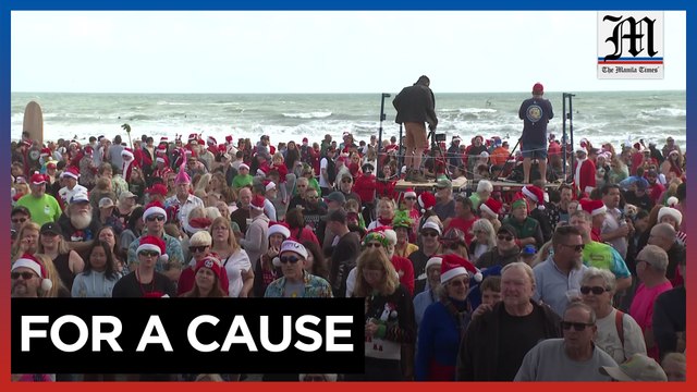Surfing Santas ride waves, raise funds in Florida
