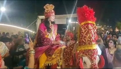 Indian bride arrived riding on a mare to invite the American groom to the wedding procession.