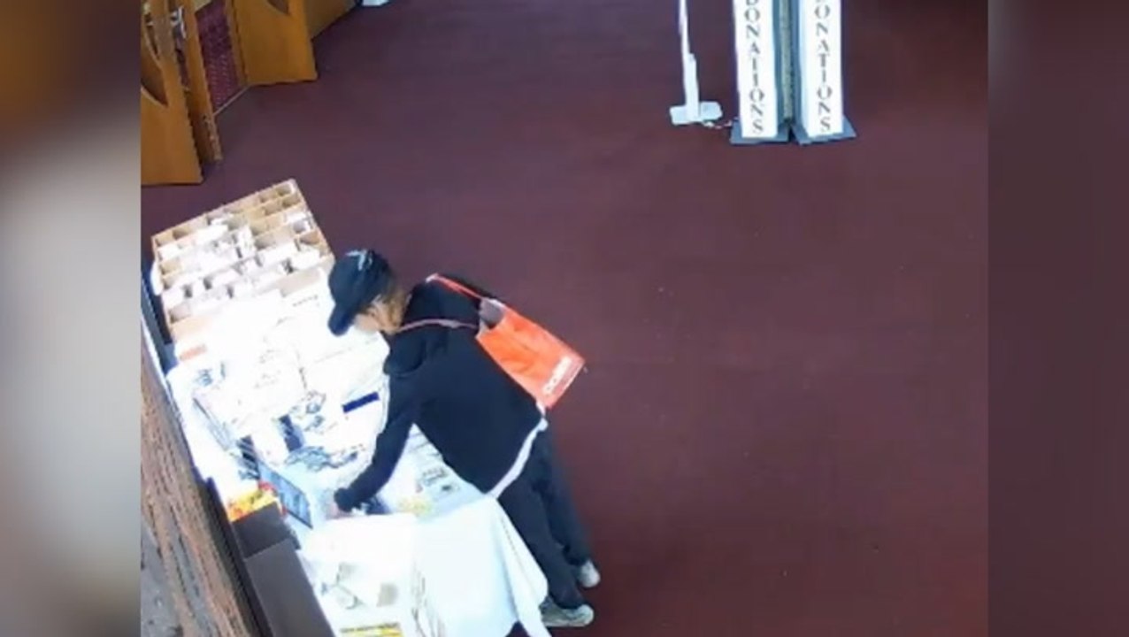 Brazen moment suspect robs church during baptism