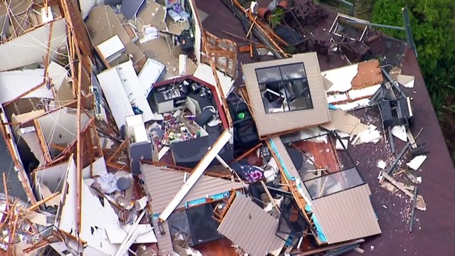 Two killed by falling in storms ravaging east coast
