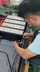 the experienced engineer are assembling the Nissan Leaf battery pack