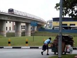 Incoming and Outgoing MRT Trains Crossing A Bridge