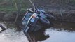 Three off-road drivers who died in submerged 4x4 were 'swept away by swollen river'
