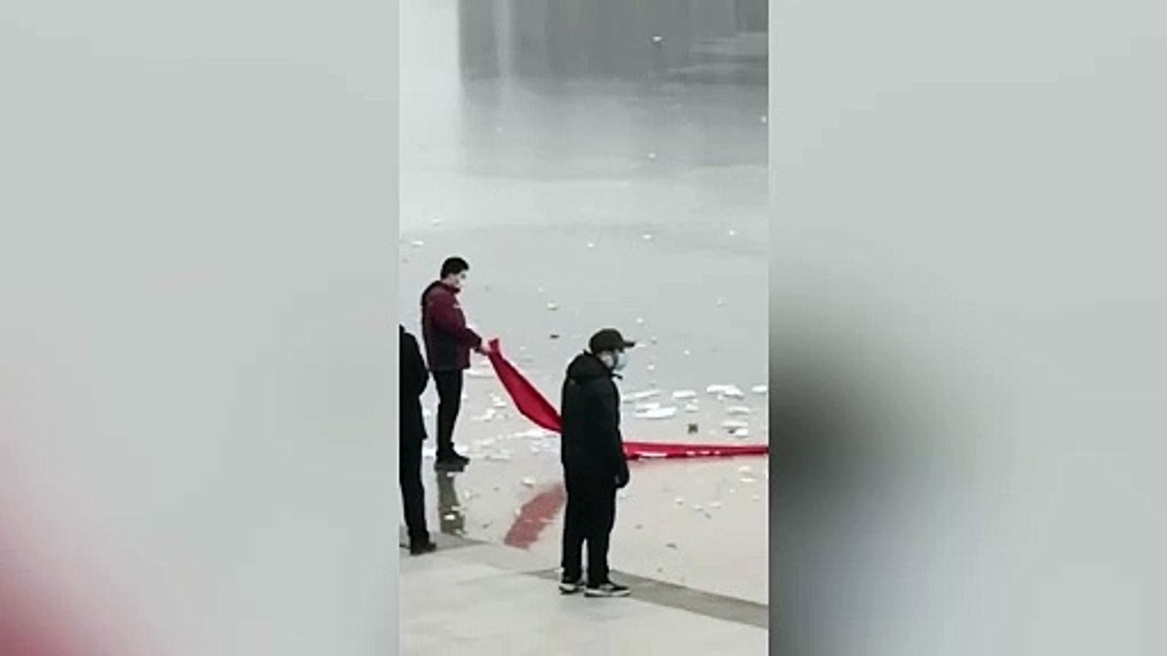 Police officer crawls across frozen lake to rescue woman who fell into the water