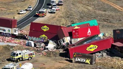 Truck driver charged over freight train crash which killed two workers