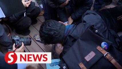 South Korea opposition chief stabbed in neck