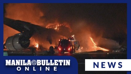 Japan Airlines plane on fire on runway at Tokyo's Haneda airport