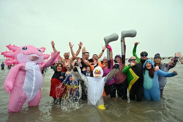 Thousands take to the sea in Saundersfoot in fancy dress for the New Year's Day Swim