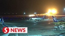 Horrific moment Japan passenger plane catches fire after landing on Tokyo runway