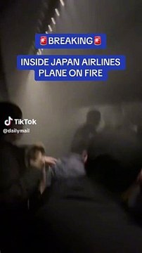 Plane ablaze on Japanese runway after collision; passengers escape