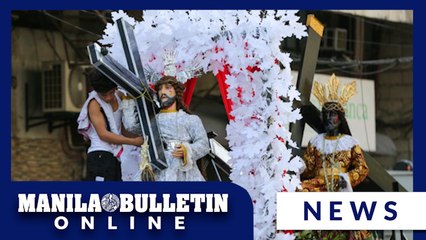 Devotees line up for the blessing of images of the Black Nazarene