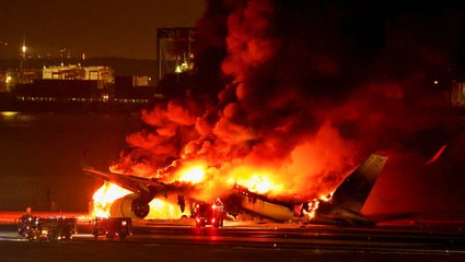 Jet bursts into flames after crash with coast guard plane at Tokyo airport