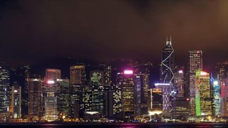 A time lapse with zoom out view of the Hong Kong cityscape at night.
