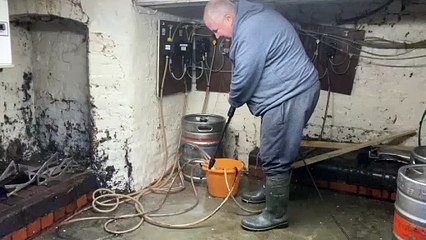 Shrewsbury landlord hoses out flood-hit cellar as River Severn drops