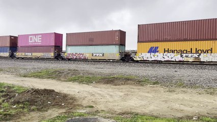 UP 7009 Leads Eastbound Auto and Stack Train Passes Through Beaumont CA