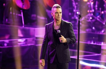 Robbie Williams worried he was "ugly" when people stopped questioning his sexuality