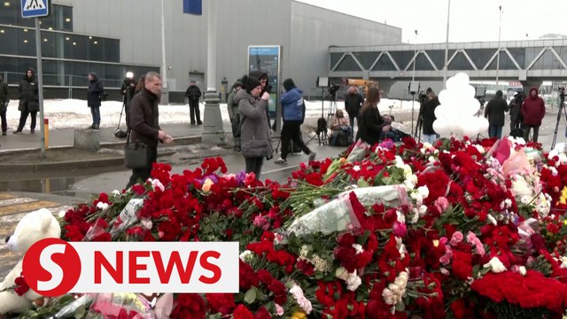 Mourners pay tribute to Russia mass shooting victims for a second day