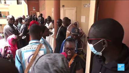 Hopes of return to stability as Senegalese vote in long-delayed election