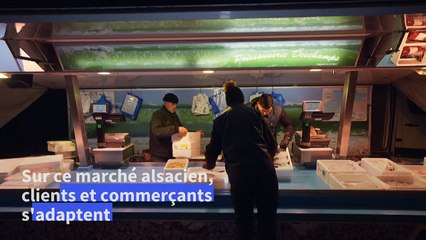 Grand froid: sur un marché de Strasbourg, clients et commerçants s'adaptent