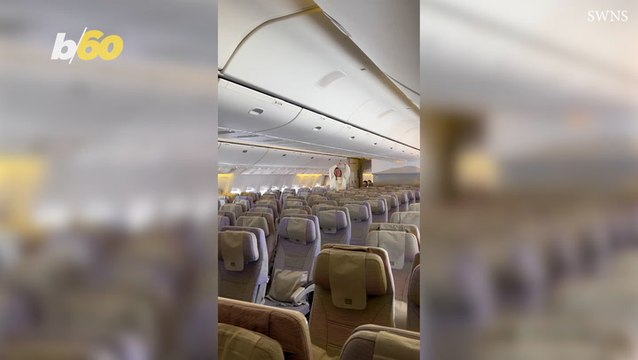 Mother and daughter have plane cabin to themselves as they dance through aisles