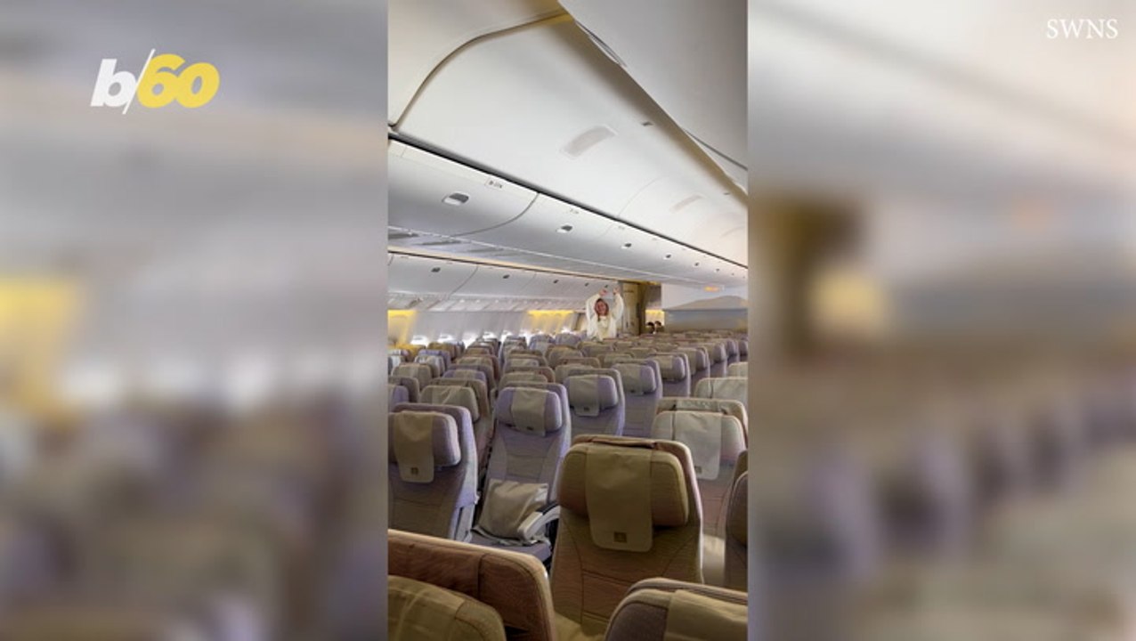 Mother and daughter have plane cabin to themselves as they dance through aisles