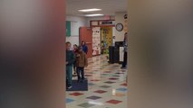 Soldier Sister Returns Home From Deployment To Surprise Younger Brother From Behind Sign | Happily TV