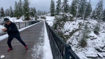 Throwing Snow Onto Icy River