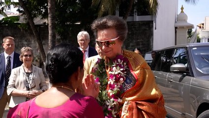 Princess Anne dons flower garland and husband smashes coconut during Hindu Temple visit