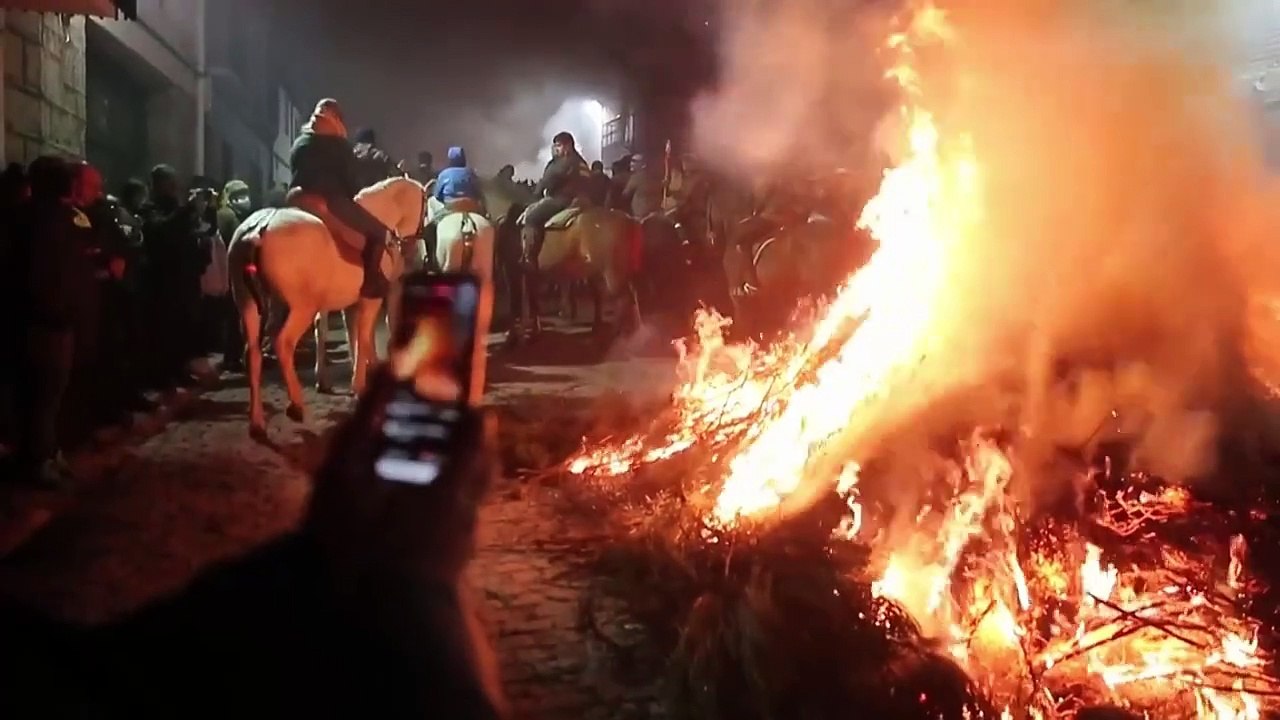 Horses jump through 'purifying' fire during Las Luminarias festival in Spain